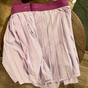 Pink athletic skirt with shorts, lightly worn
